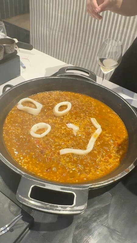 Paella with a smile made from calamari